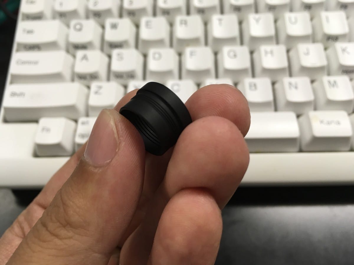 img_1653 A close up of a person holding a computer keyboard