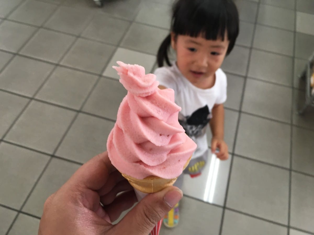 img_1542 A baby sitting on a tiled floor