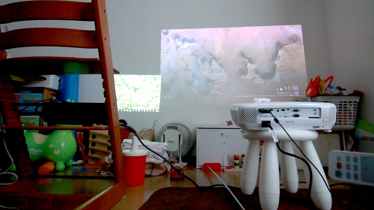 A bedroom with a computer on a desk