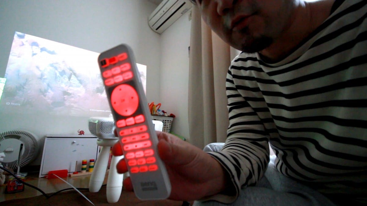 A man holding a remote control