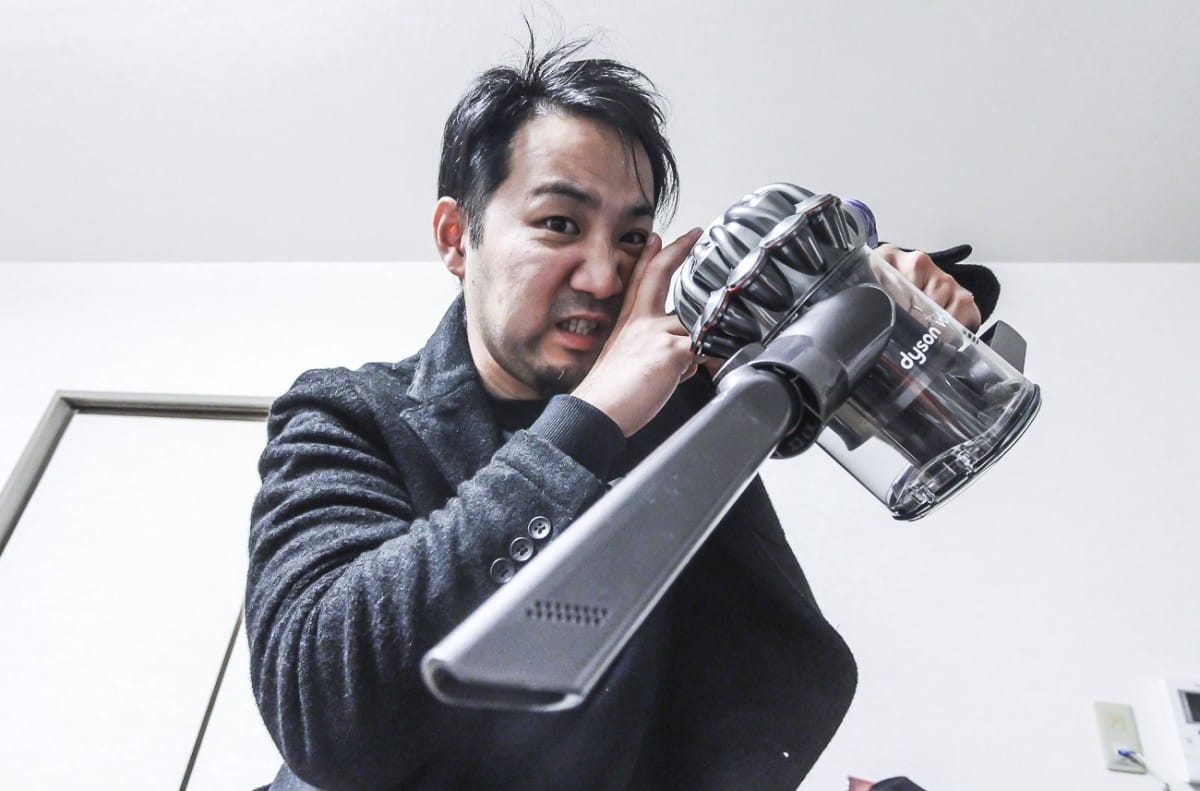 IMG_9180 A man holding a cell phone