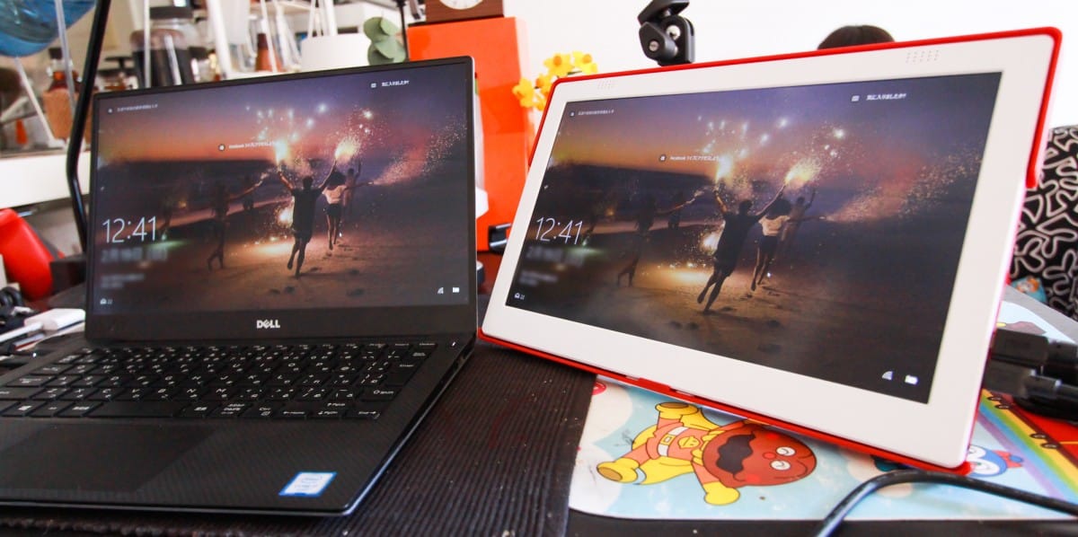 An open laptop computer sitting on a table