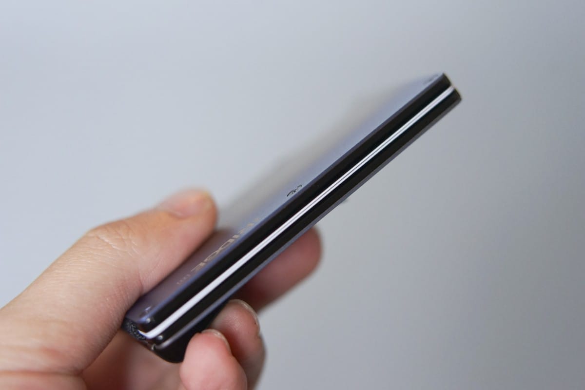 A hand holding a cell phone