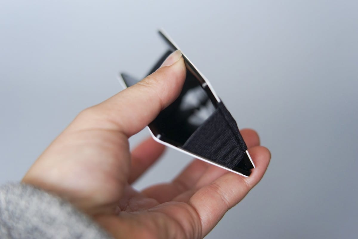 A hand holding a cell phone