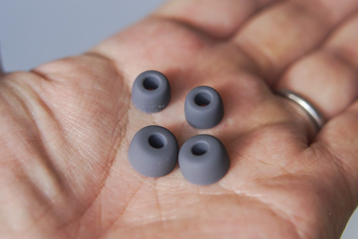 A close up of a person holding a nintendo wii game controllers