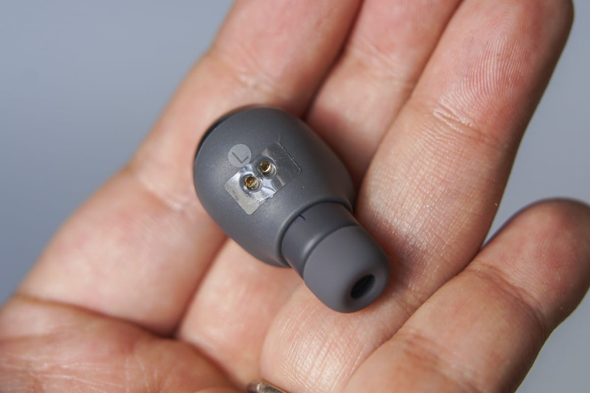 A hand holding a remote control