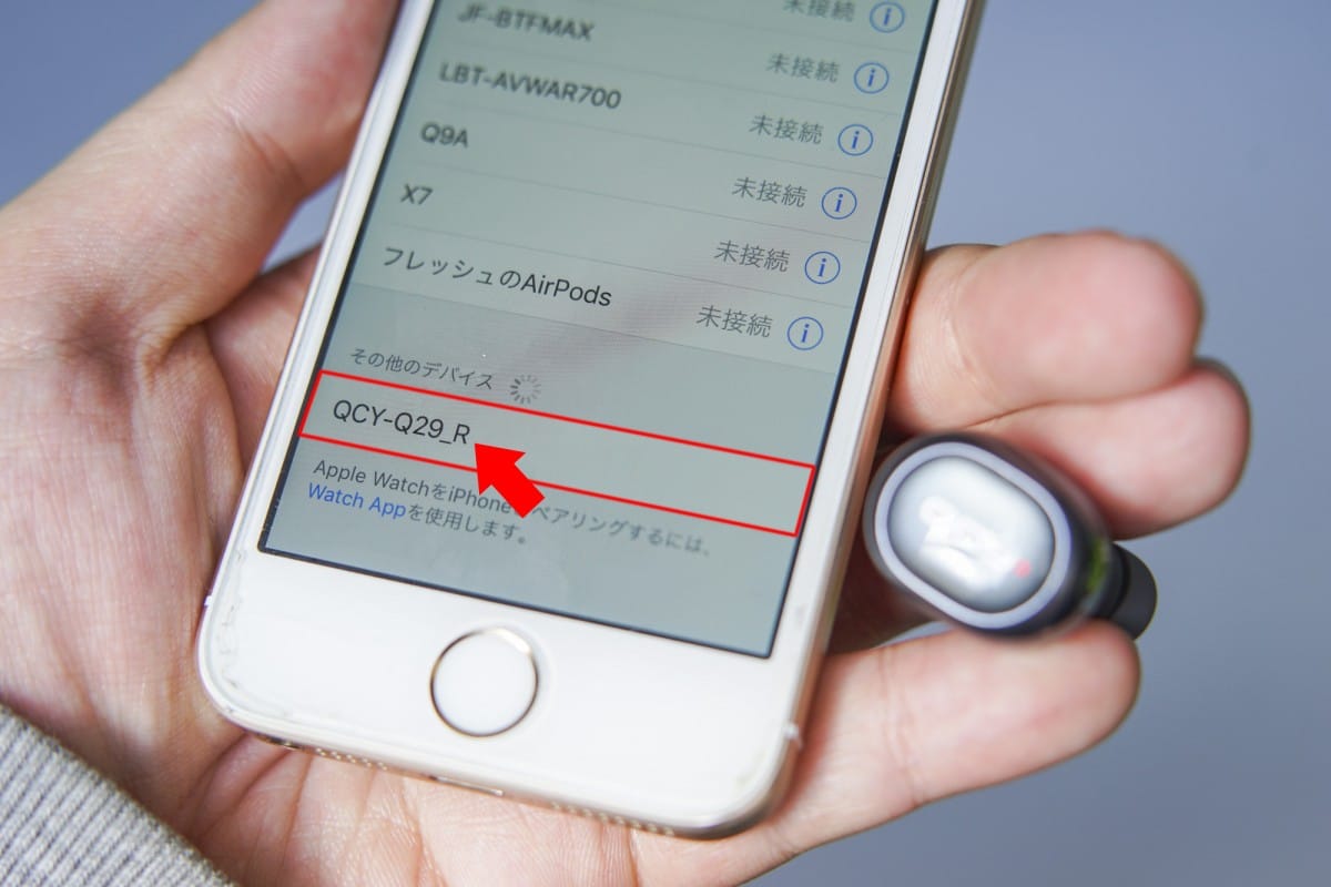 A hand holding a cell phone