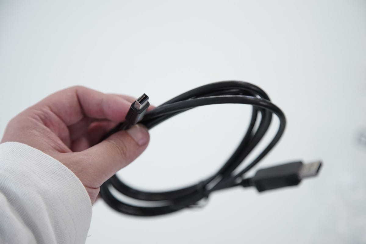 A hand holding a large pair of scissors