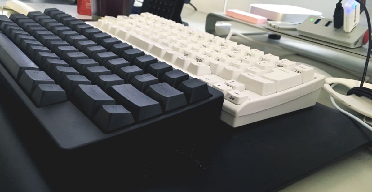 A desk with a computer keyboard