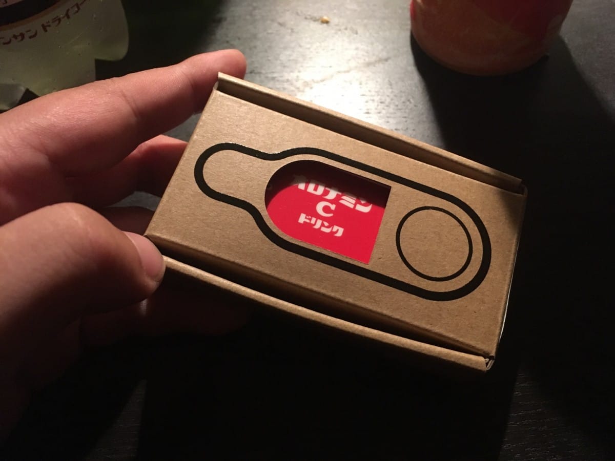 IMG_4113 A hand holding a black object