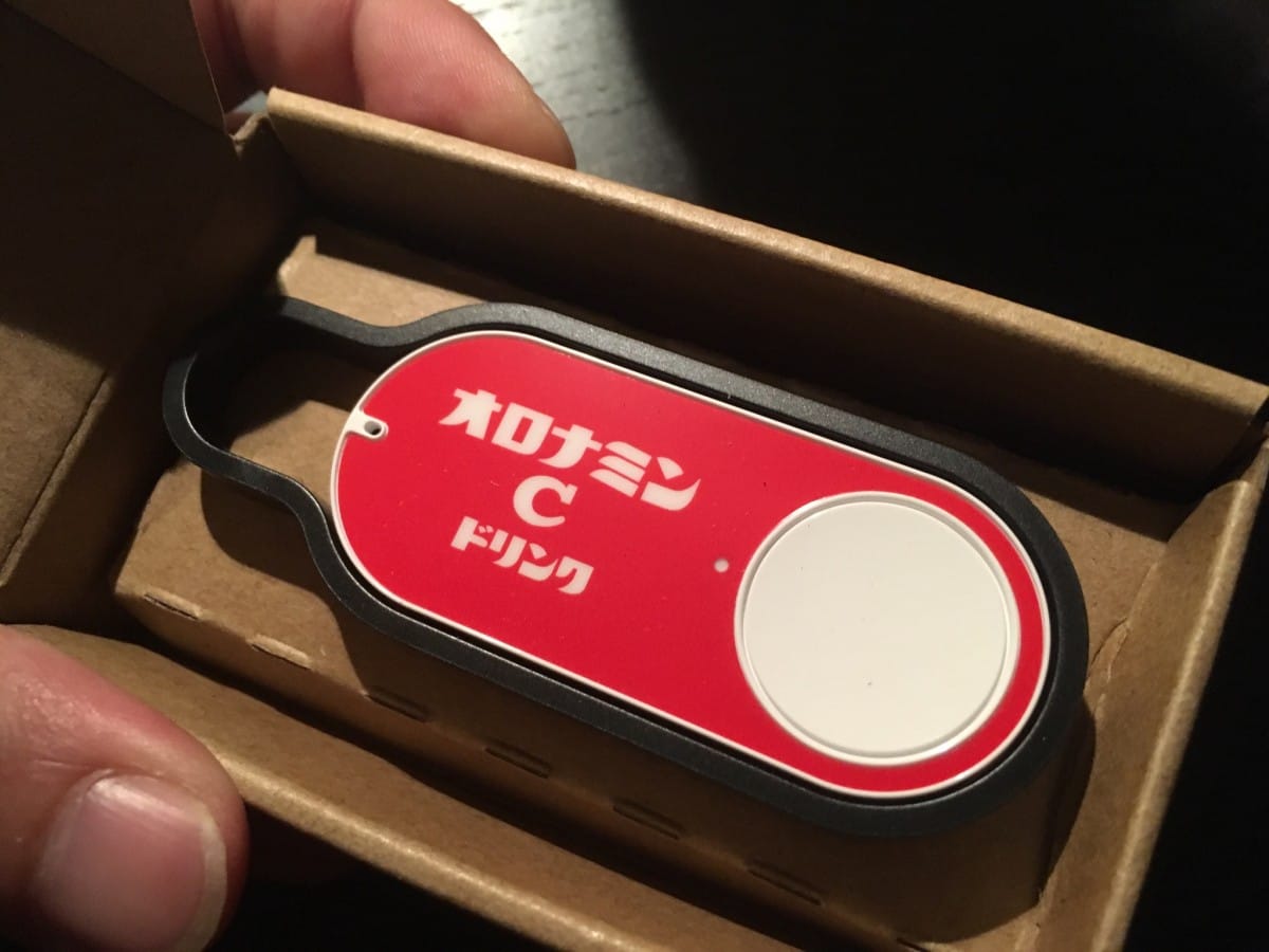 IMG_4115 A hand holding a remote control