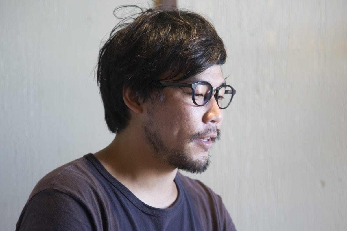 A man in glasses looking at the camera