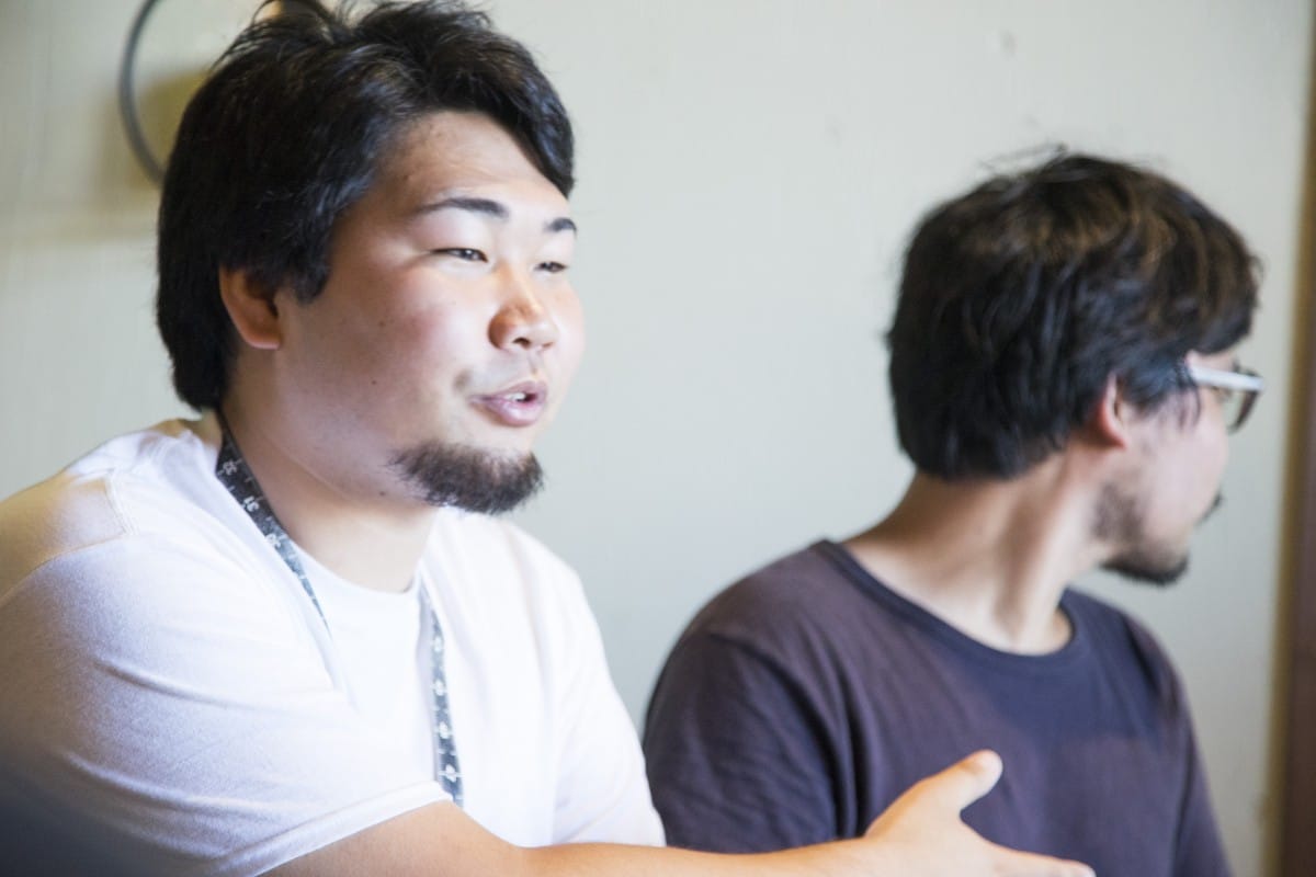 A man and a woman looking at the camera