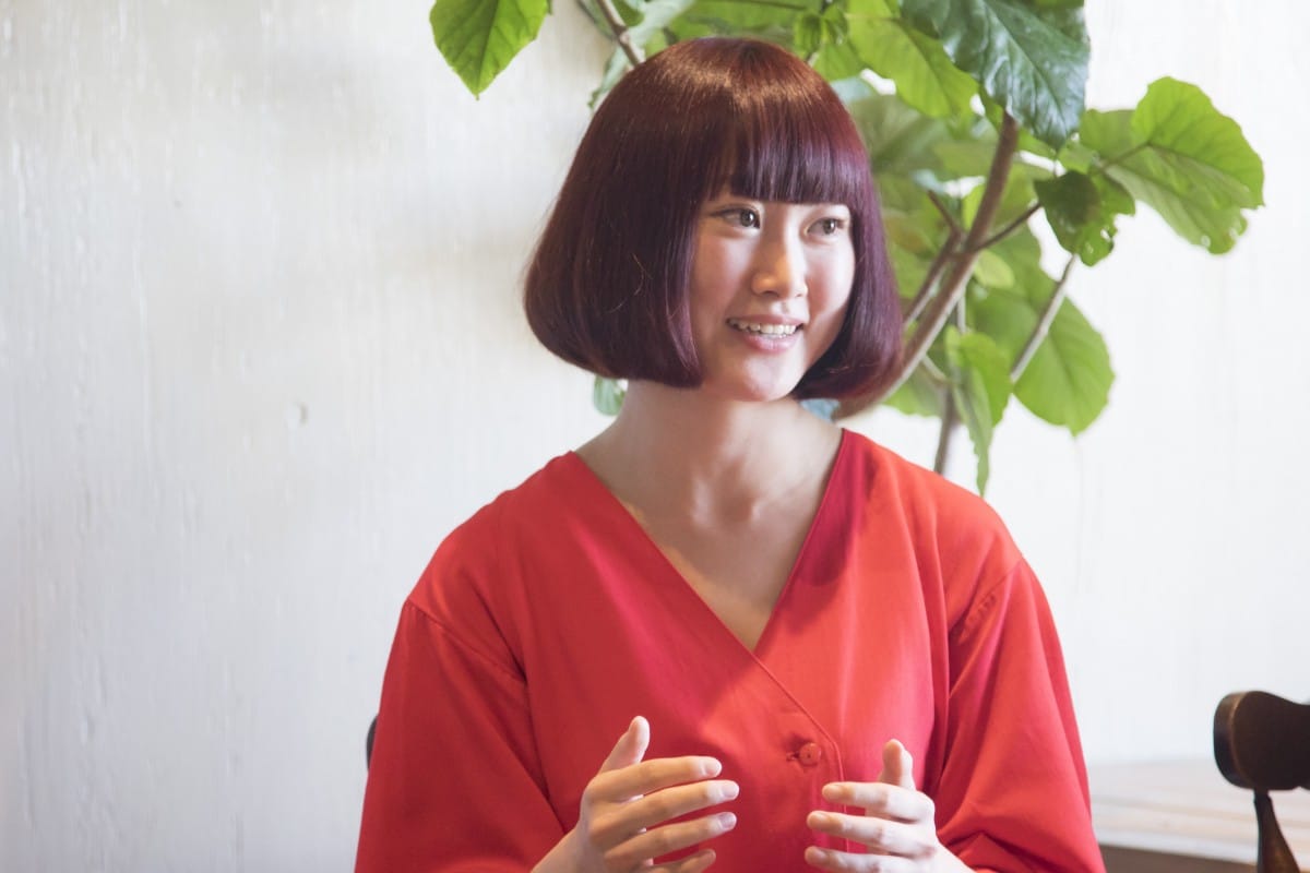 A woman in a red shirt