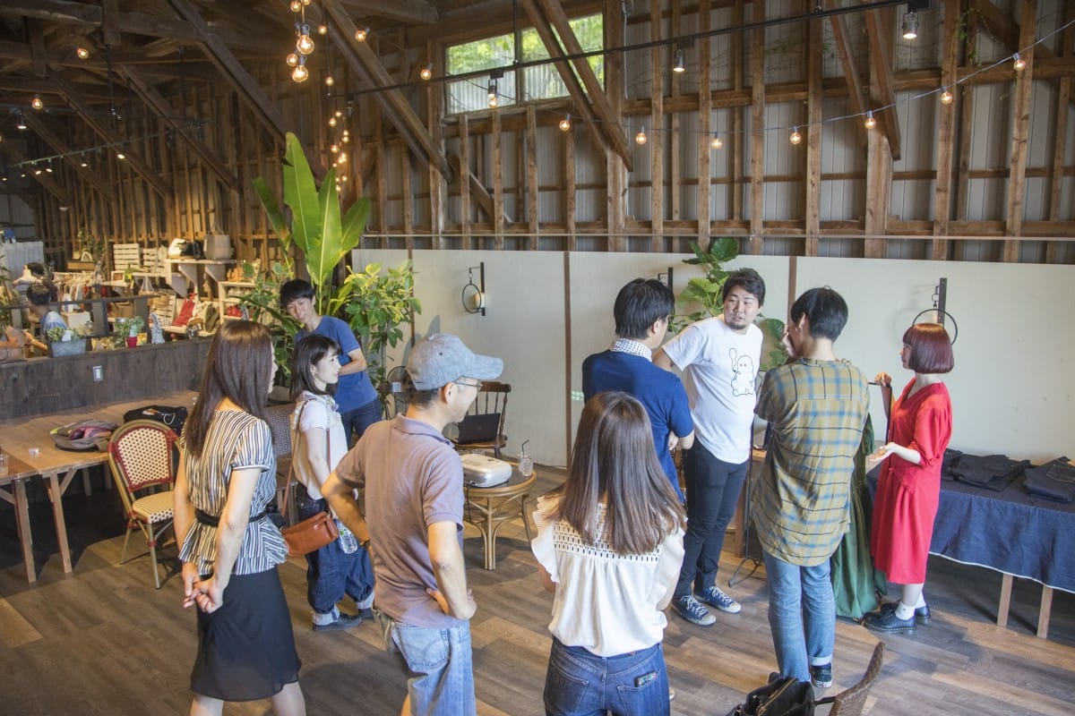 A group of people standing in a room