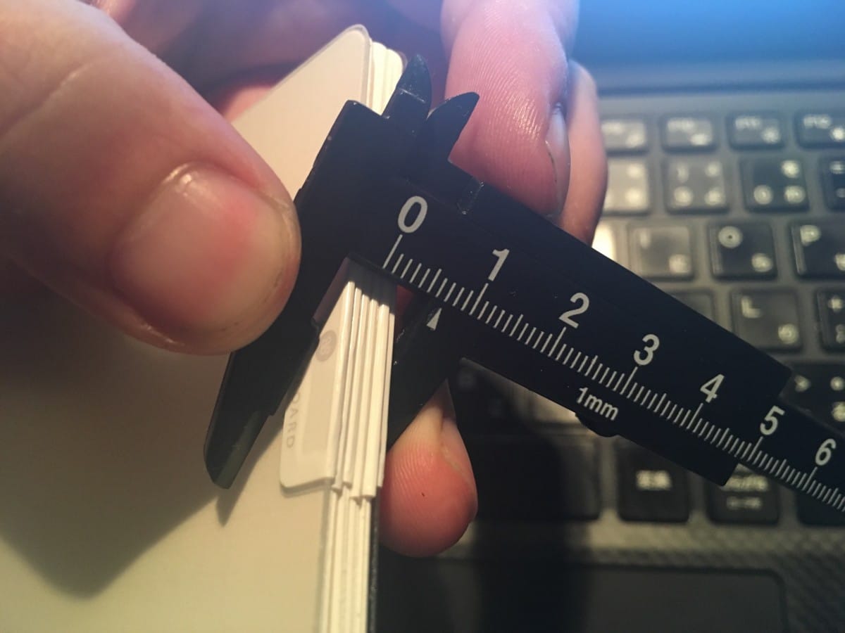 A hand holding a cell phone